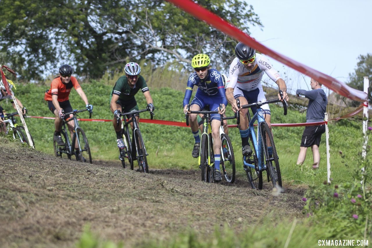 Tim Strelecki leads with Peter Swinand into one of the first muddy corners. 2019 CCC Hopkins Park CX at Indian Lakes. © Z. Schuster / Cyclocross Magazine