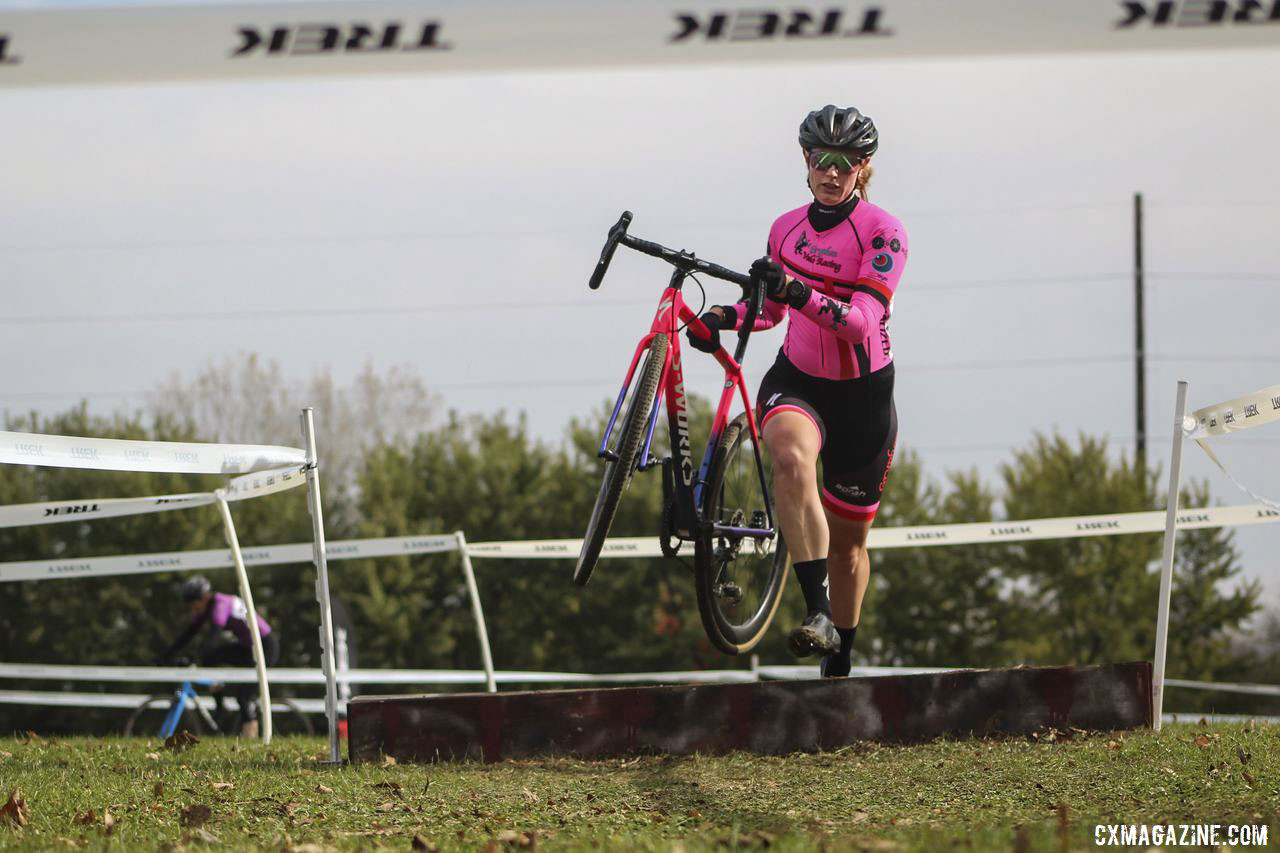 Bailey Rudolph runs over one of the two coffins. 2019 Cross Fire Halloween Race, Wisconsin. © Z. Schuster / Cyclocross Magazine