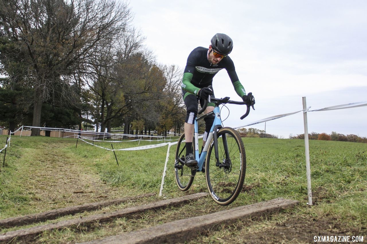 Isaac Neff hops the railroad ties. 2019 Cross Fire Halloween Race, Wisconsin. © Z. Schuster / Cyclocross Magazine