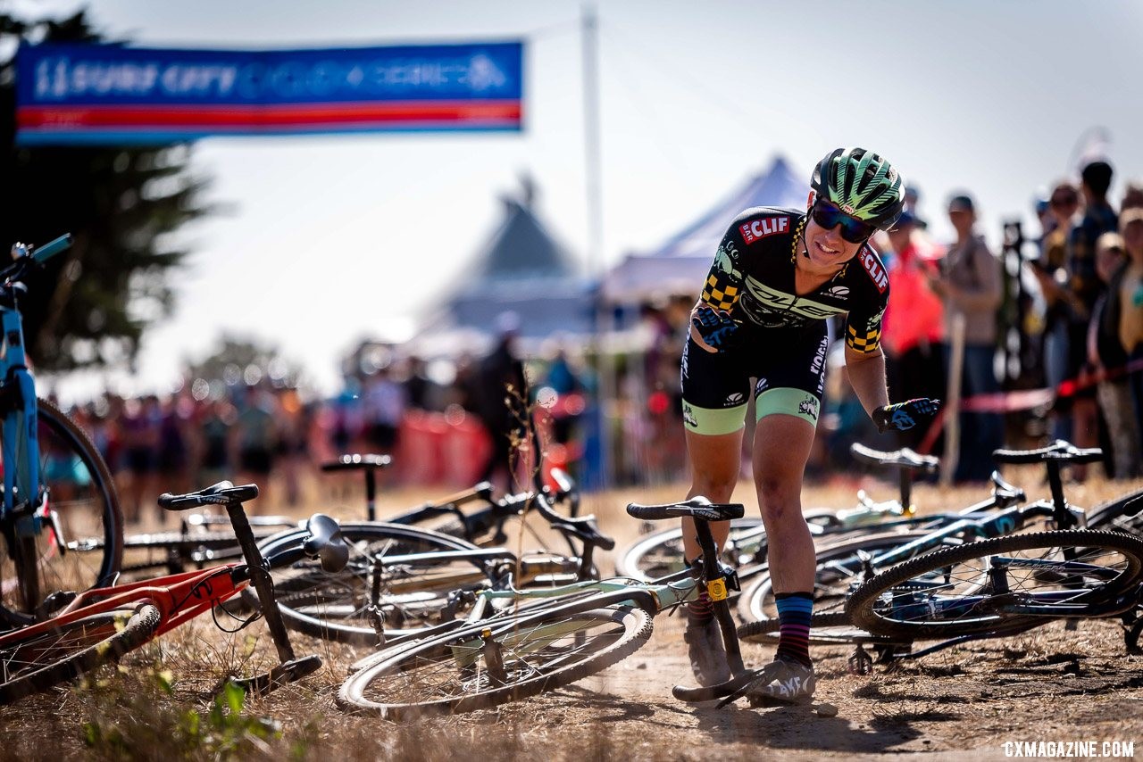 Women's A winner Caroline Nolan got heckled pretty good for running up to play with her computer before the Le Mans style start. 2019 Surf City CX. © Jeff Vander Stucken