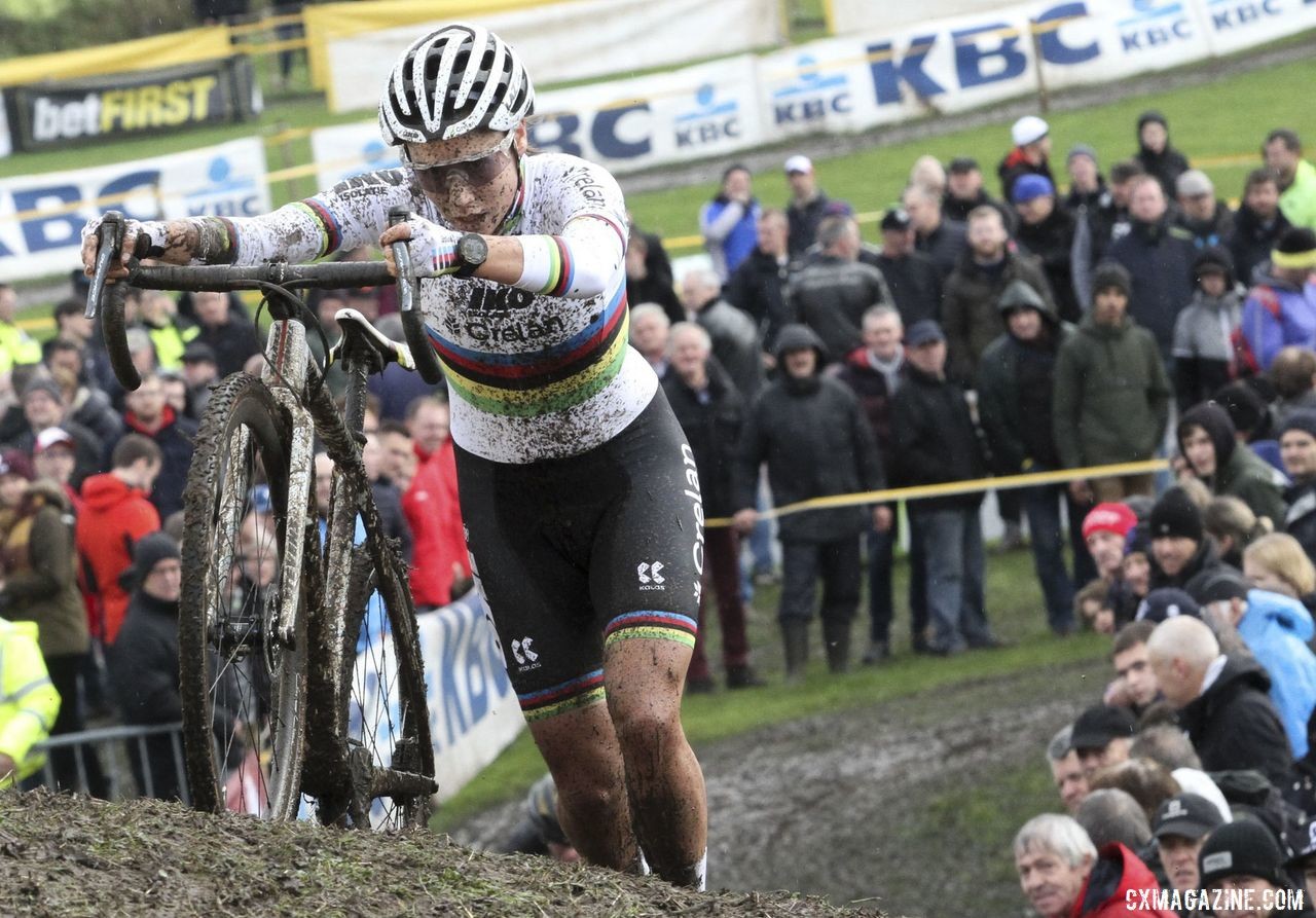 Sanne Cant pushes her bike up one of the muddy run-ups. 2019 Superprestige Ruddervoorde. © B. Hazen / Cyclocross Magazine