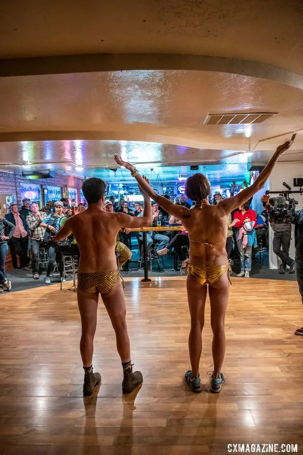 The King and Queen greet the crowd in the traditional golden bikinis at the after party. 2019 Singlespeed Cyclocross World Championships, Utah. © Jeff Vander Stucken