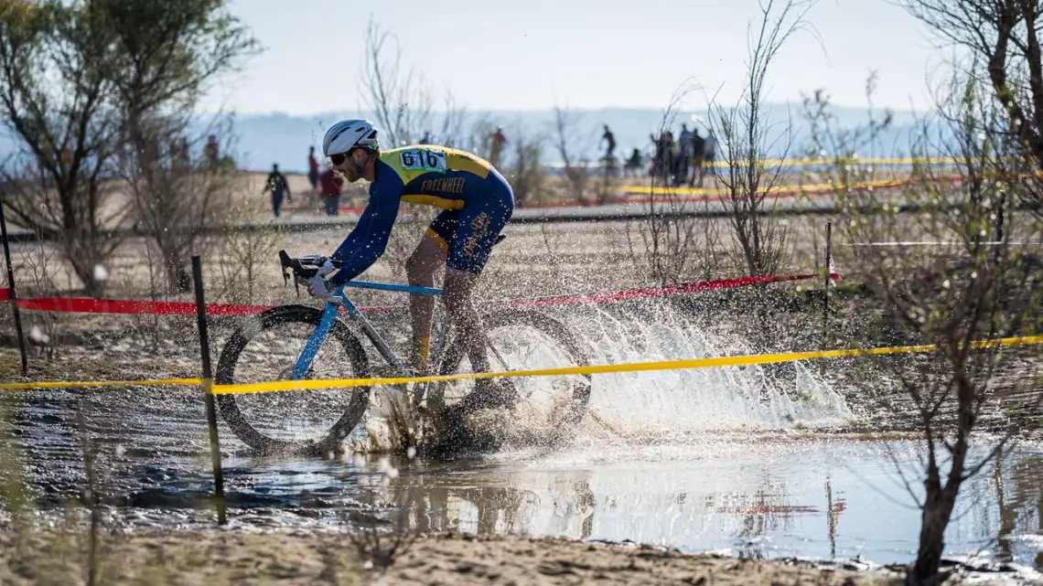 Puddle crossings, mud and heavy sand made for a heavy track. 2019 Sacramento CX Granite Beach, California. © Jeff Vander Stucken