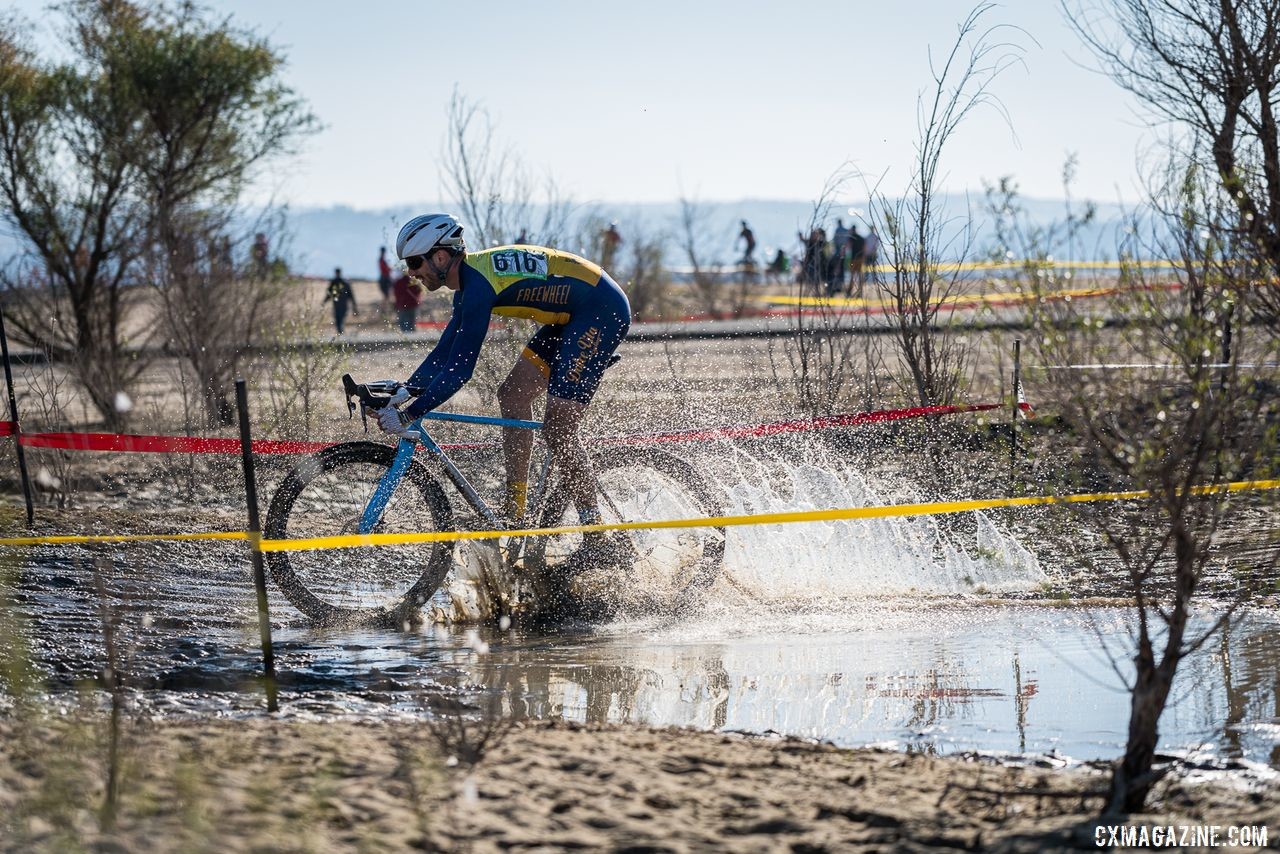 Puddle crossings, mud and heavy sand made for a heavy track. 2019 Sacramento CX Granite Beach, California. © Jeff Vander Stucken