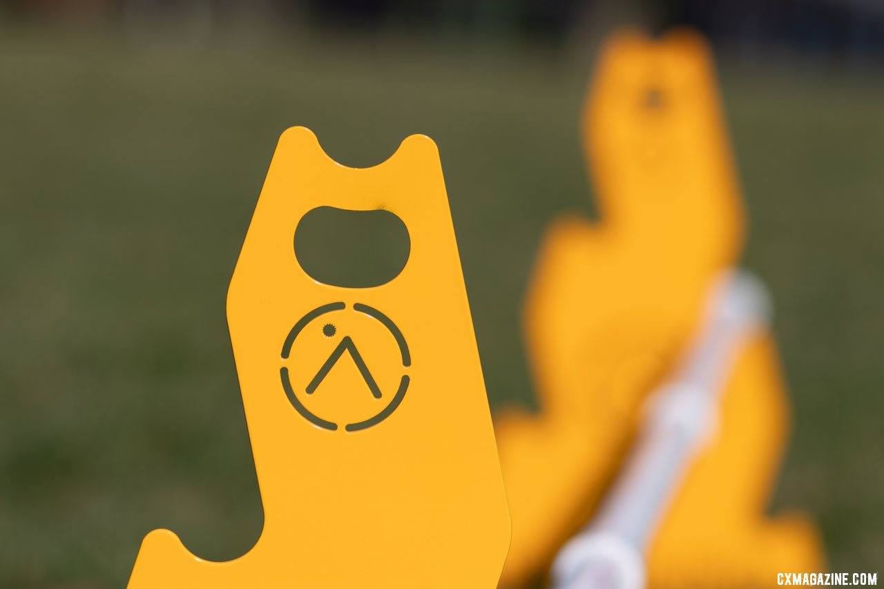 The Up.Bike portable barriers help facilitate hand-ups with a handy bottle opener. © A. Yee / Cyclocross Magazine