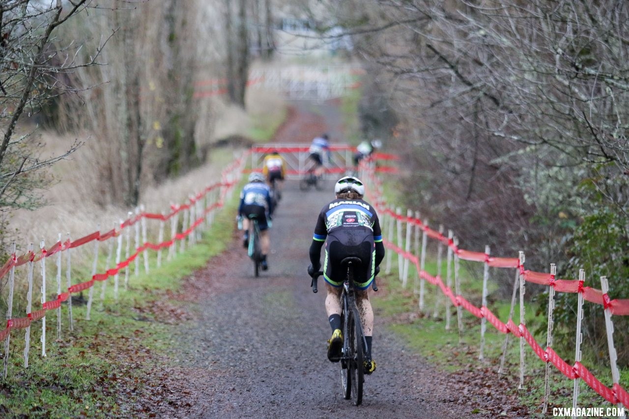 A long line of collegiate racers rolls into the second half of the course. Collegiate Varsity Men. 2019 Cyclocross National Championships, Lakewood, WA. © D. Mable / Cyclocross Magazine