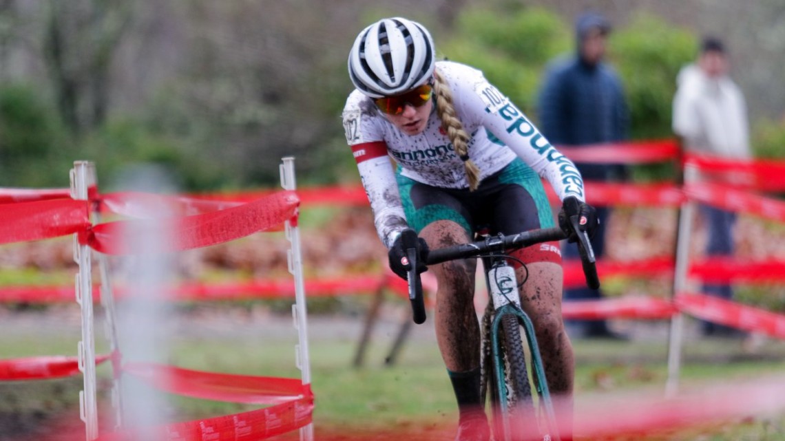 Katie Clouse leans into a corner in a sea of course tape. U23 Women. 2019 Cyclocross National Championships, Lakewood, WA. © D. Mable / Cyclocross Magazine