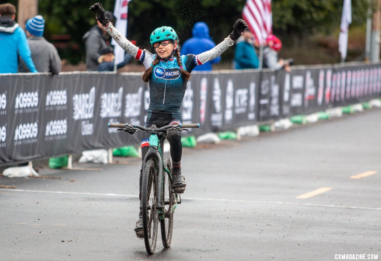 Kira Mullens posts up like a pro as she crosses the line as a new National Champion. Junior Women 11-12. 2019 Cyclocross National Championships, Lakewood, WA. © A. Yee / Cyclocross Magazine