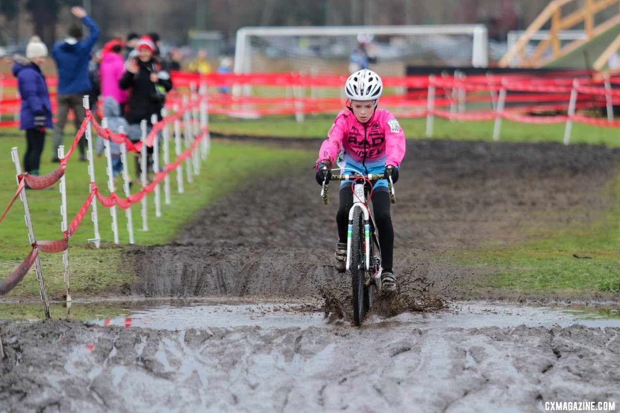 Hudson Congdon makes a splash on the Fort Steilacoom park cyclocross course. Junior Men 11-12. 2019 Cyclocross National Championships, Lakewood, WA. © D. Mable / Cyclocross Magazine