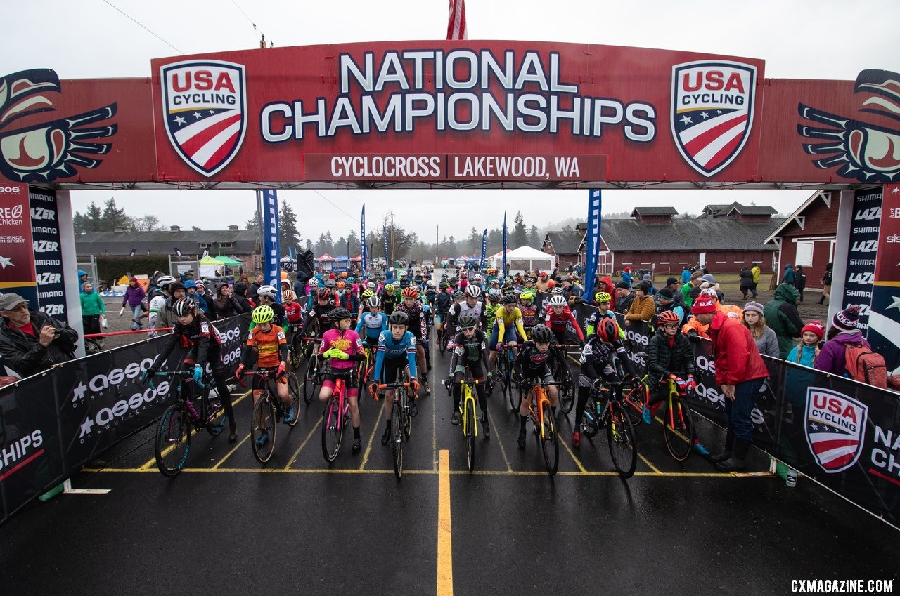 The field of 62 Junior Men 13-14 year old riders waits for the green light on the mornings first championship race. Junior Men 13-14. 2019 Cyclocross National Championships, Lakewood, WA. © A. Yee / Cyclocross Magazine