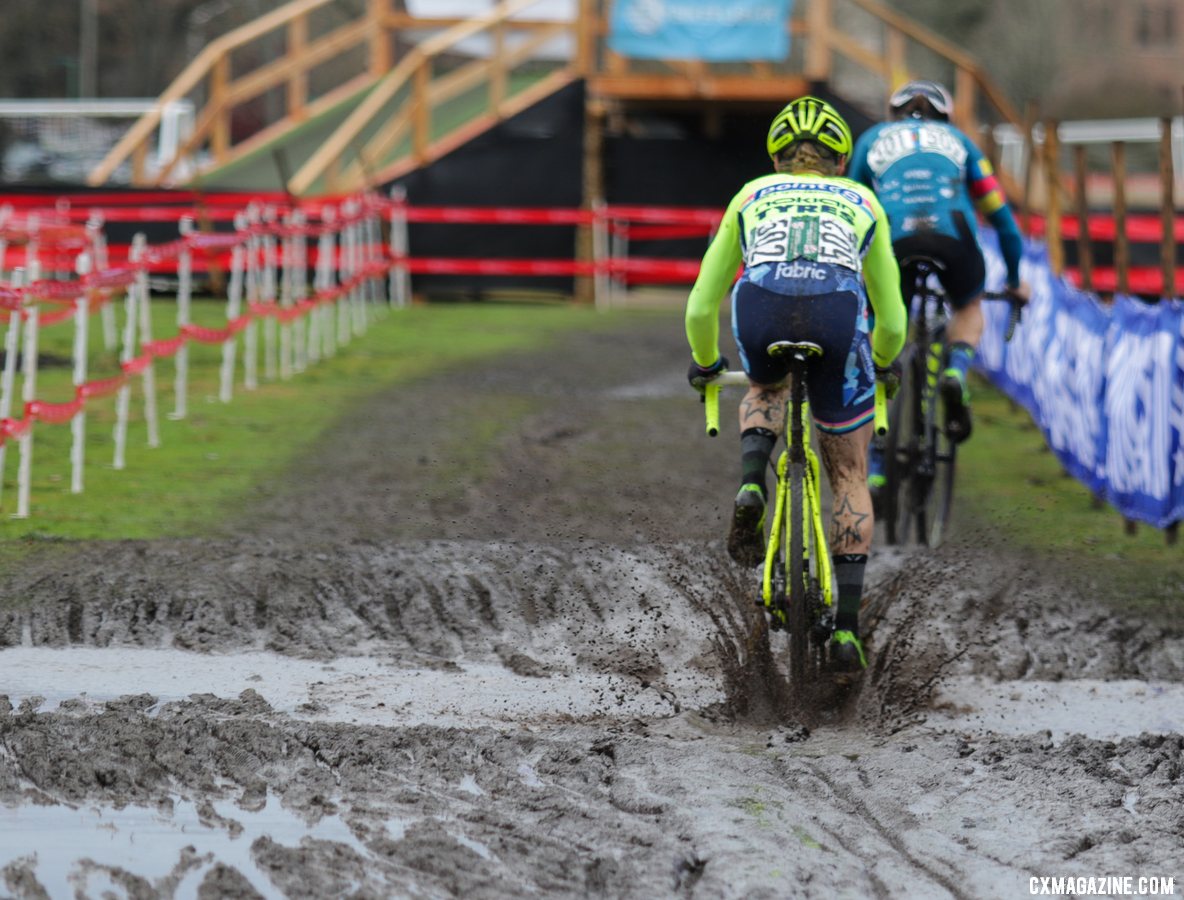 Molly Cameron splashes through the mud as he chases Jake Wells. Masters Men 40-44. 2019 Cyclocross National Championships, Lakewood, WA. © D. Mable / Cyclocross Magazine