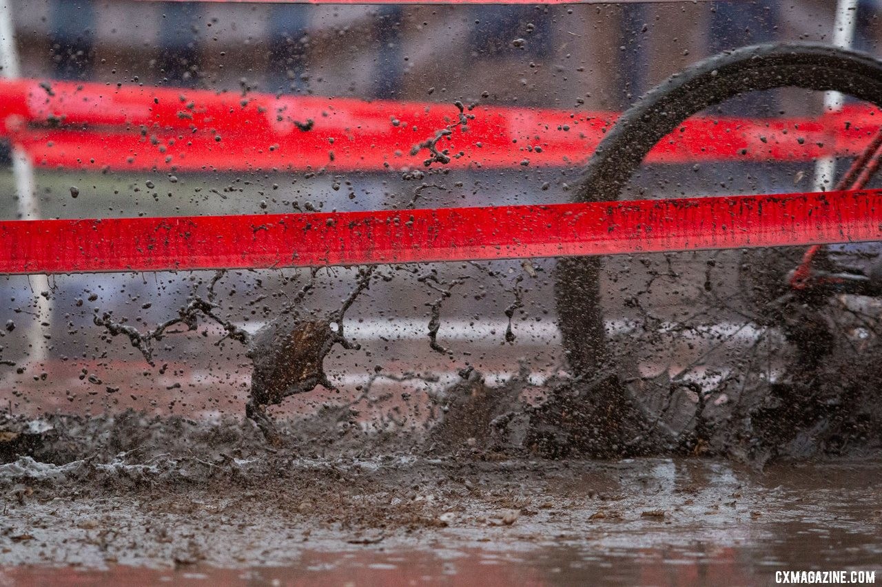 By the pits, the power washers made for big puddles. Masters Men 45-49. 2019 Cyclocross National Championships, Lakewood, WA. © A. Yee / Cyclocross Magazine