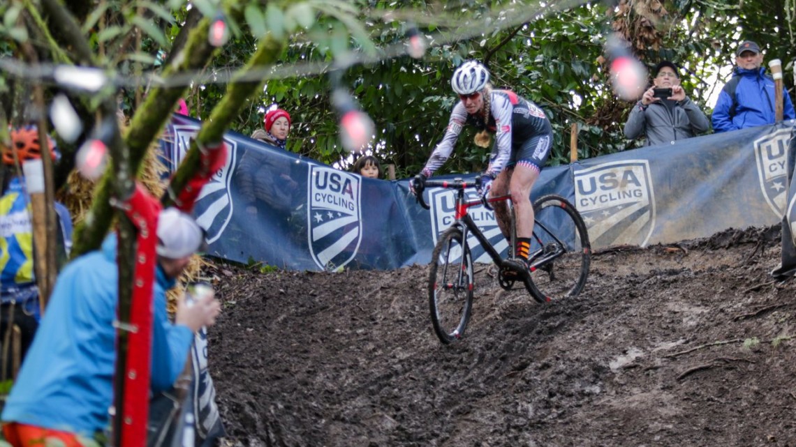 Melissa Barker slides under the disco lights on a slippery descent. Masters Women 45-49. 2019 Cyclocross National Championships, Lakewood, WA. © D. Mable / Cyclocross Magazine