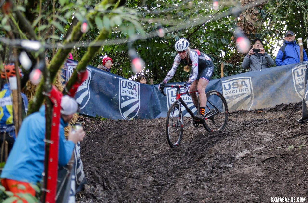 Melissa Barker slides under the disco lights on a slippery descent. Masters Women 45-49. 2019 Cyclocross National Championships, Lakewood, WA. © D. Mable / Cyclocross Magazine