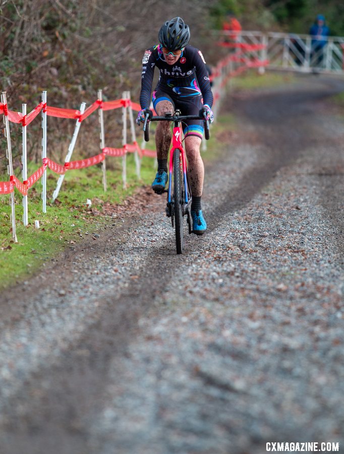 Julie Robertson Zivin rolls up the gravel lane that leads to the old apple orchard. Masters Women 50-54. 2019 Cyclocross National Championships, Lakewood, WA. © A. Yee / Cyclocross Magazine