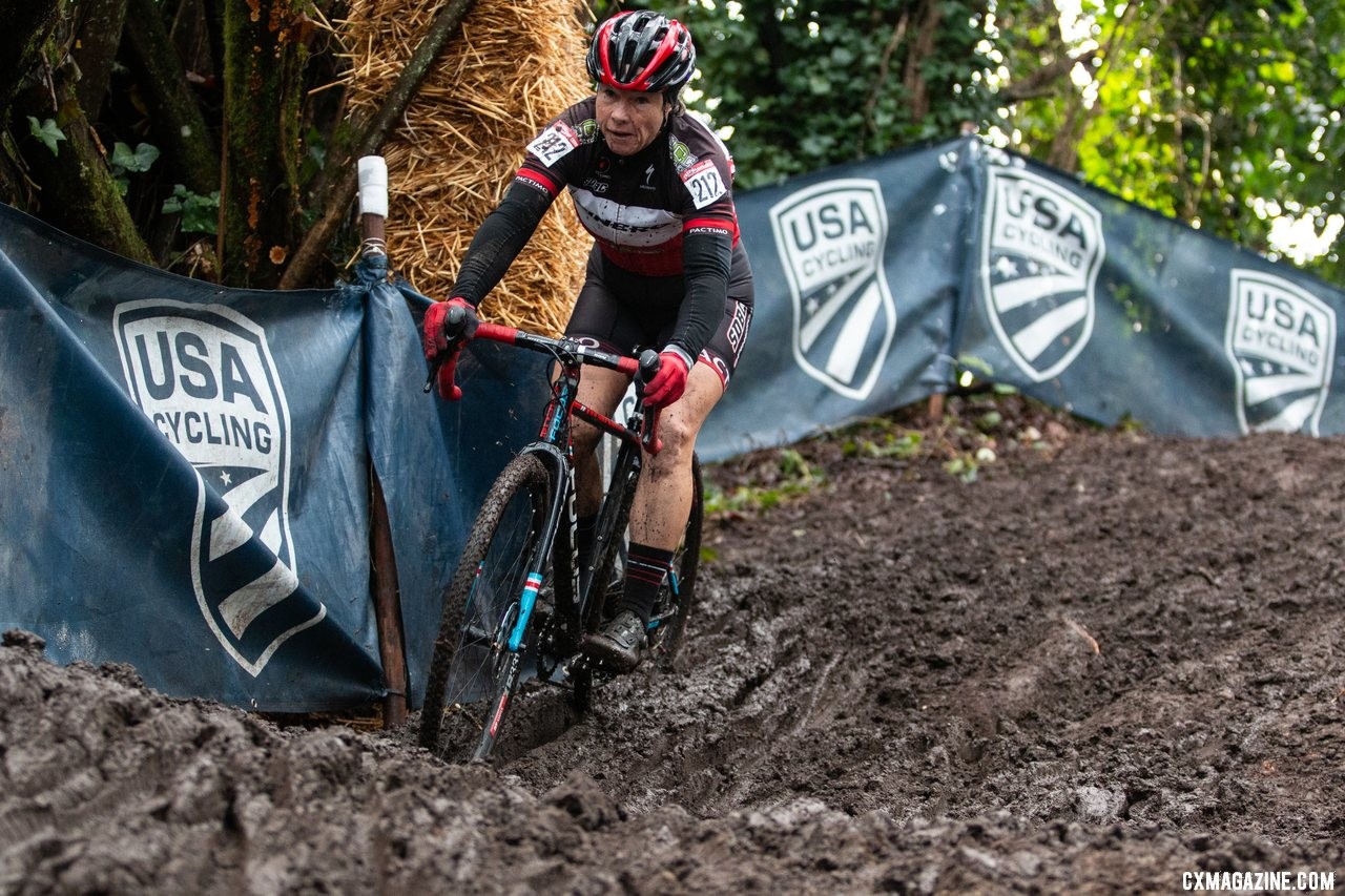 Patricia Murray slices through a deep run on her way down one of the steep muddy hills on the course. Masters Women 55-59. 2019 Cyclocross National Championships, Lakewood, WA. © A. Yee / Cyclocross Magazine