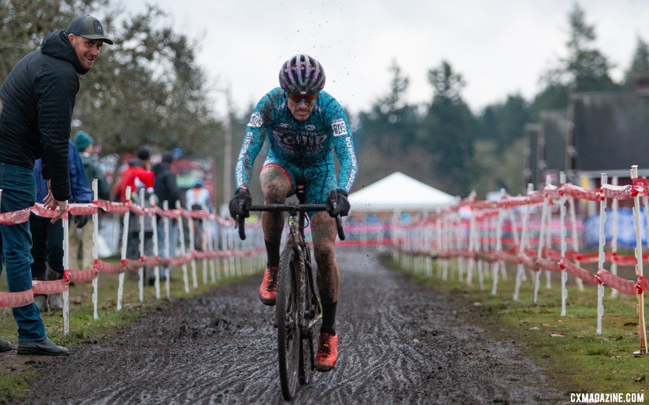 That guy on the left is just stoked to get his mug in a pic. Meanwhile Anthony Clark is racin'. Singlespeed Men. 2019 Cyclocross National Championships, Lakewood, WA. © A. Yee / Cyclocross Magazine