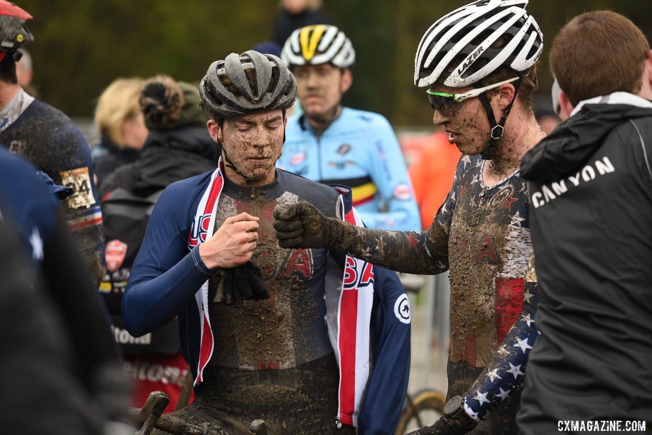 U.S. riders share a fist bump after their race. U23 Men, 2019 Namur UCI Cyclocross World Cup. © B. Hazen / Cyclocross Magazine