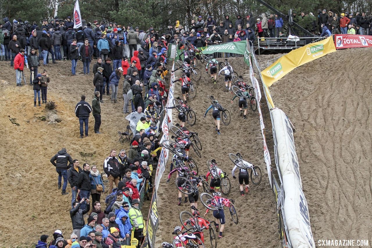 The Elite Women scramble up the steep wall of The Pit. 2019 Superprestige Zonhoven. © B. Hazen / Cyclocross Magazine