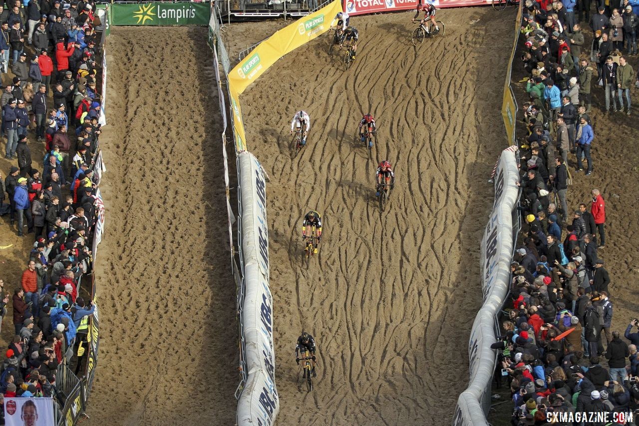 The lead group takes different lines down the sandy descent. 2019 Superprestige Zonhoven. © B. Hazen / Cyclocross Magazine