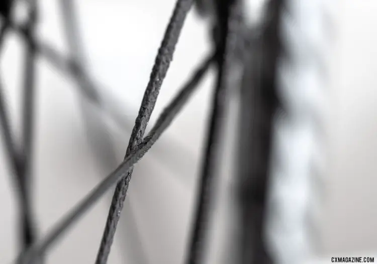 Berd's polymer spokes claim 12 times the strenght to weight ratio of steel spokes. Atomik's Ultimate Berd carbon tubeless wheels with Berd polyethylene spokes. © Cyclocross Magazine