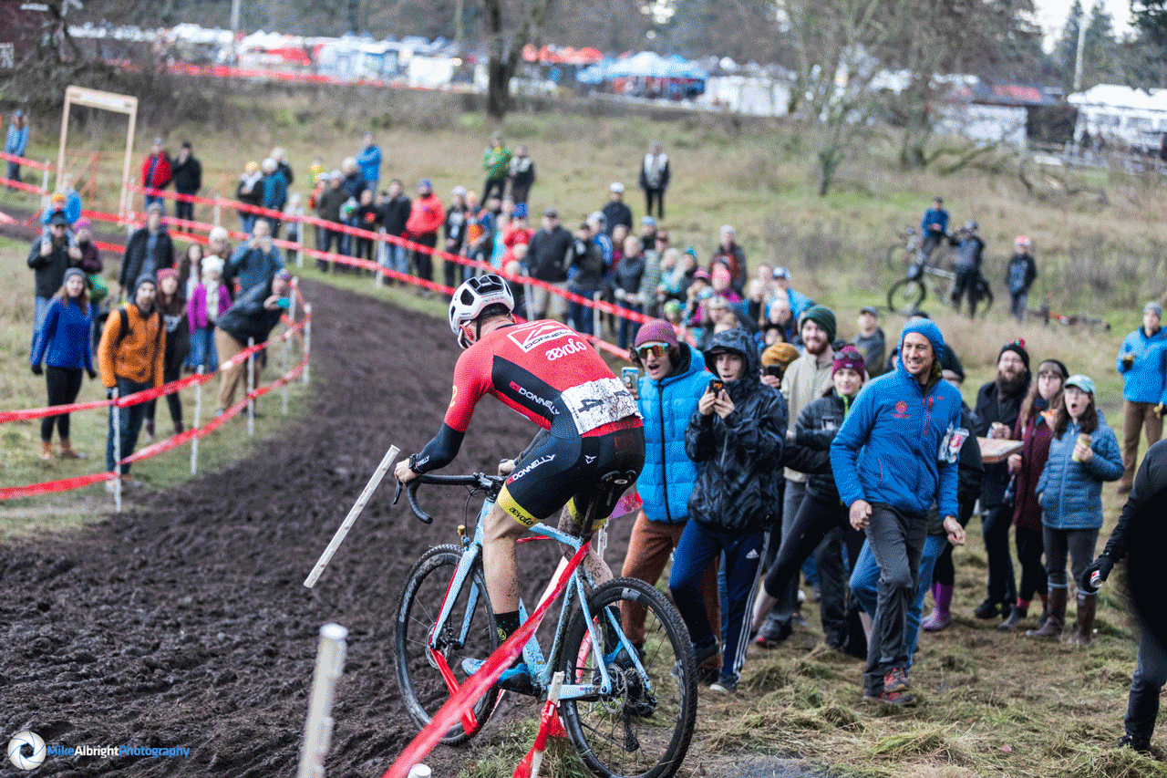 Gage Hecht and Kerry Werner get caught in the course tape on lap two at the 2019 Cyclocross Nationals. Photographer Mike Albright captured the sequence. © Mike Albright