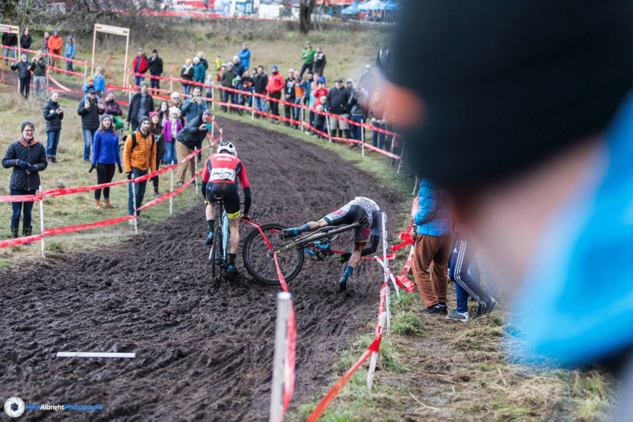 Gage Hecht and Kerry Werner get caught in the course tape on lap two at the 2019 Cyclocross Nationals. Photographer Mike Albright captured the sequence. © Mike Albright