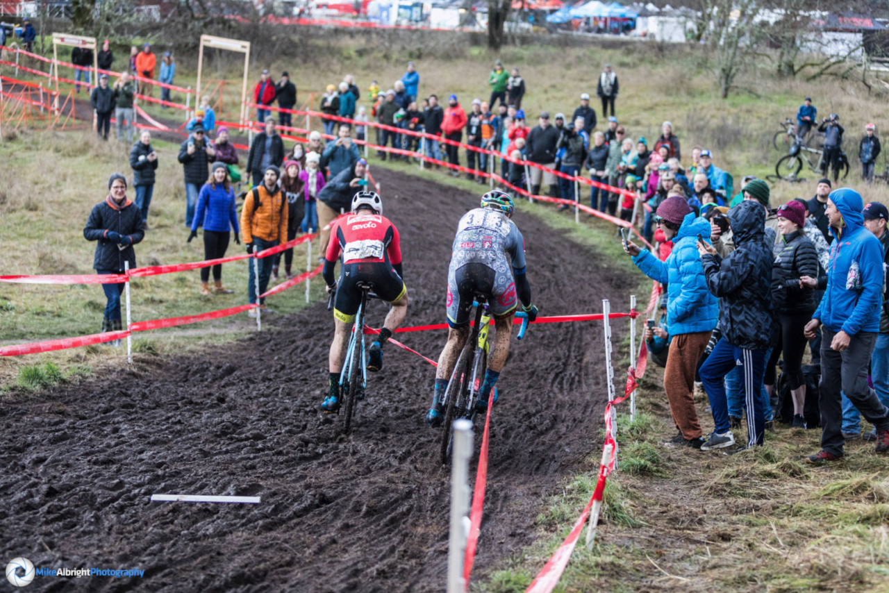 Gage Hecht and Kerry Werner get caught in the course tape on lap two at the 2019 Cyclocross Nationals. Photographer Mike Albright captured the sequence. © Mike Albright