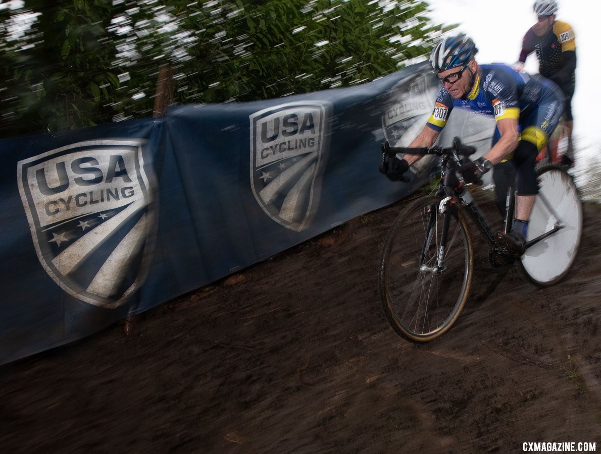 Paul Curley and his iconic spoke cover caught attention from fans and competitors. Masters Men 65-69. 2019 Cyclocross National Championships, Lakewood, WA. © A. Yee / Cyclocross Magazine