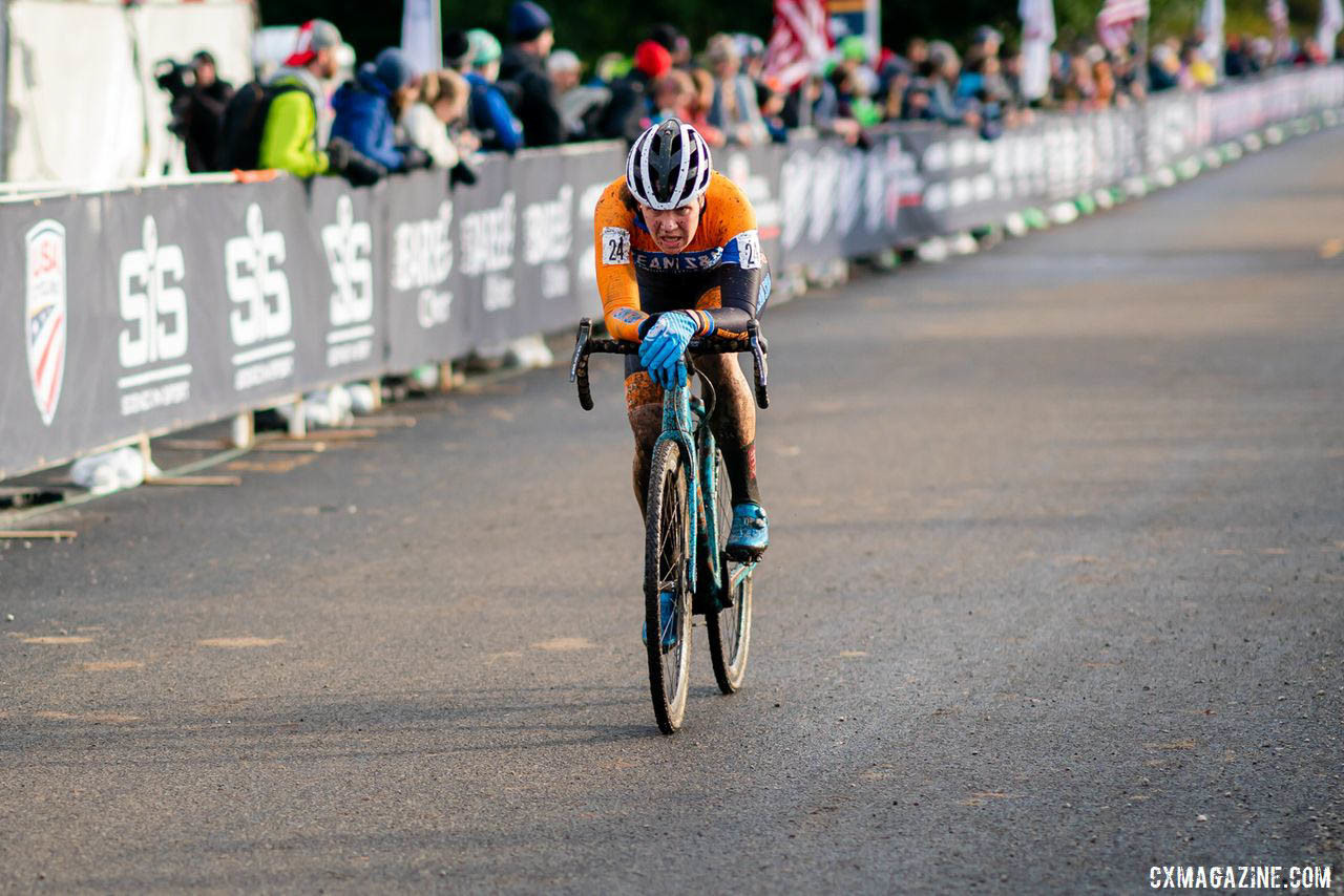 Honsinger's teammate Beth Ann Orton in time trial mode, draped across the bars on the long finishing straight. 2019 Lakewood U.S. Cyclocross Nationals. © Drew Coleman