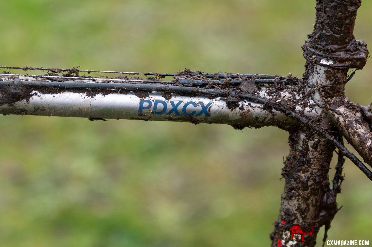 Mud obscures another look at the patented Cable Clip System that gives riders a choice of how many cable stops they want or need on the top tube. of Jack Spranger's Jr 15-16 winning Sage PDXCX cyclocross bike. 2019 Cyclocross National Championships, Lakewood, WA. © A. Yee / Cyclocross Magazine