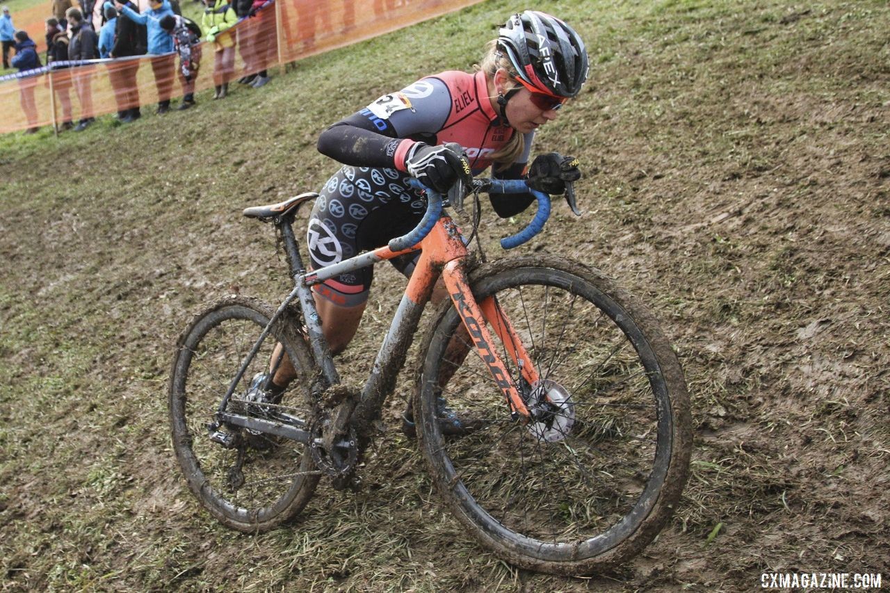 Rebecca Fahringer pushes her bike up one of the slick hills. 2020 World Cup Nommay, France. © B. Hazen / Cyclocross Magazine