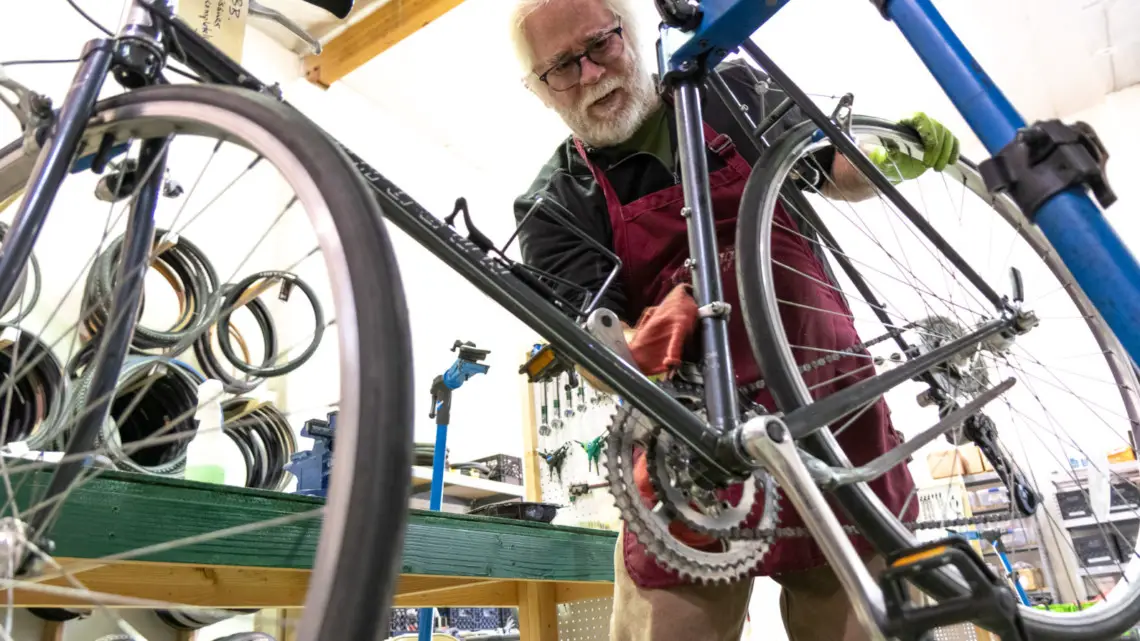 A Silicon Valley Bicycle Exchange volutneer working on a perfect gravel bike candidate, for someone in need of a bike.
