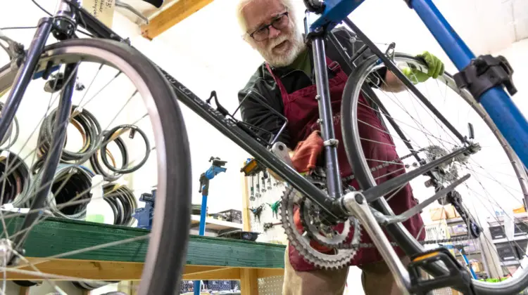 A Silicon Valley Bicycle Exchange volutneer working on a perfect gravel bike candidate, for someone in need of a bike.