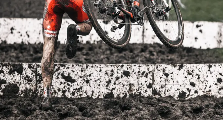 Lee Waldman sprints through the mud.