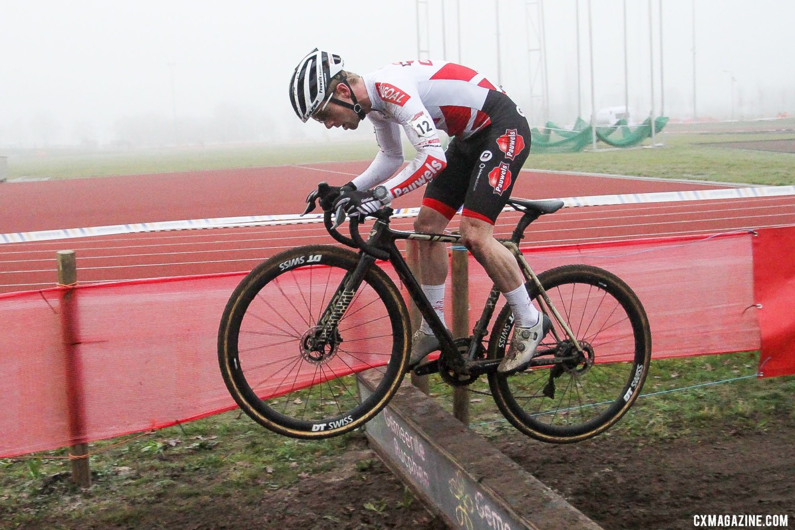 Eli Iserbyt bunnyhopped the barrier. 2021 Rucphen UCI Cyclocross World Cup, Elite Men. © B. Hazen / Cyclocross Magazine