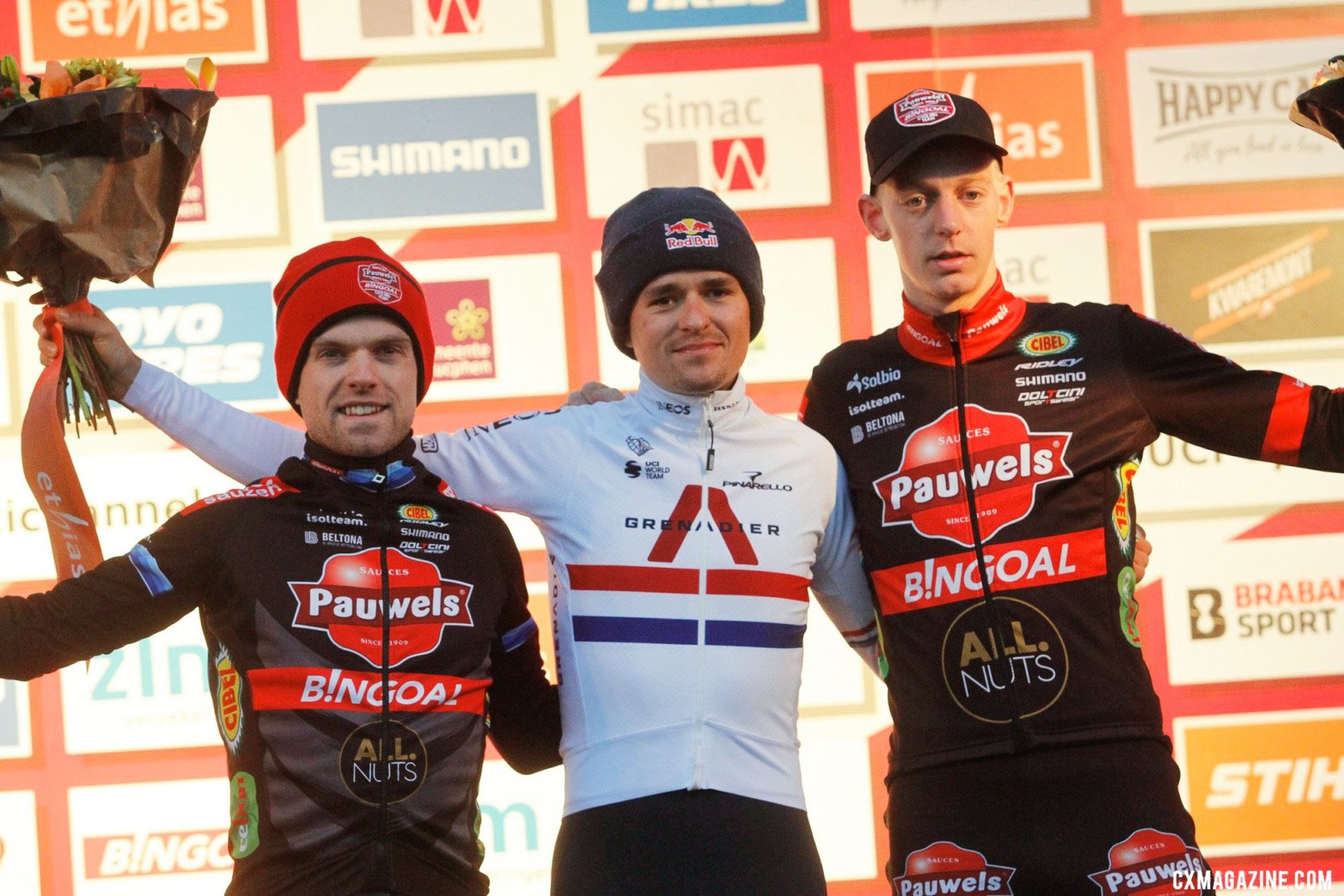 Tom Pidcock, Eli Iserbyt, and Michael Vanthourenhout on the podium. 2021 Rucphen UCI Cyclocross World Cup, Elite Men. © B. Hazen / Cyclocross Magazine