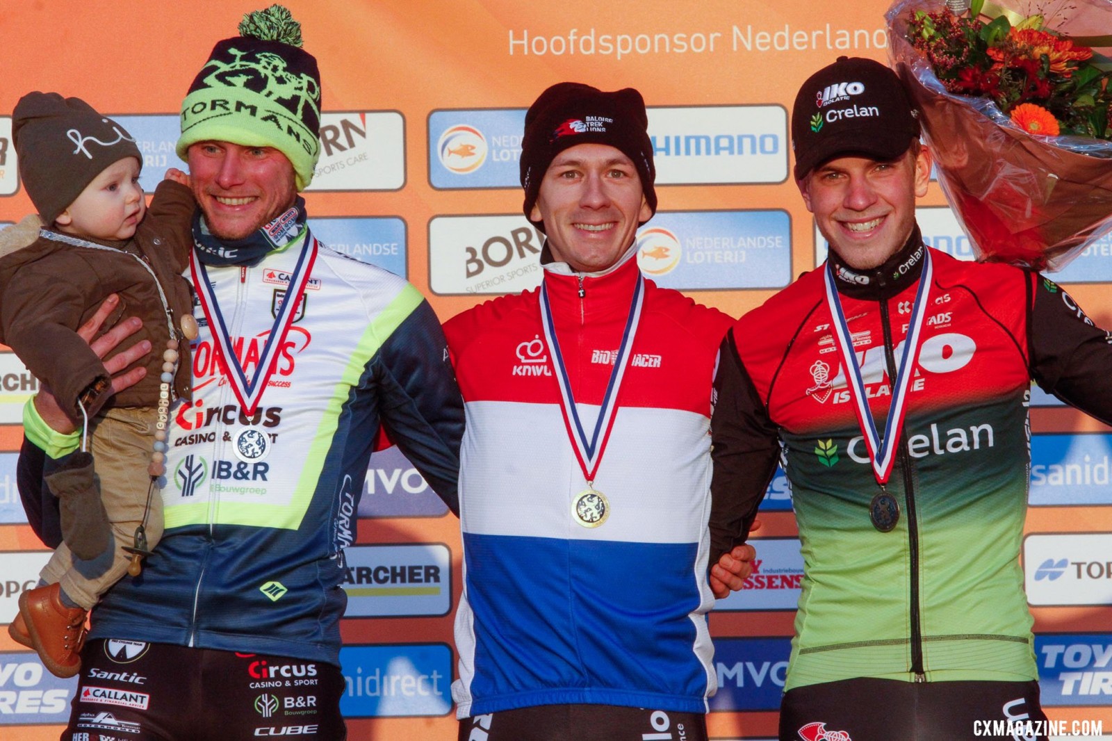 Lars van der Haar, Corné van Kessel, and Mees Hendrikx on the podium. 2022 Dutch Cyclocross National Championships, Elite Men. Rucphen. © B. Hazen / Cyclocross Magazine