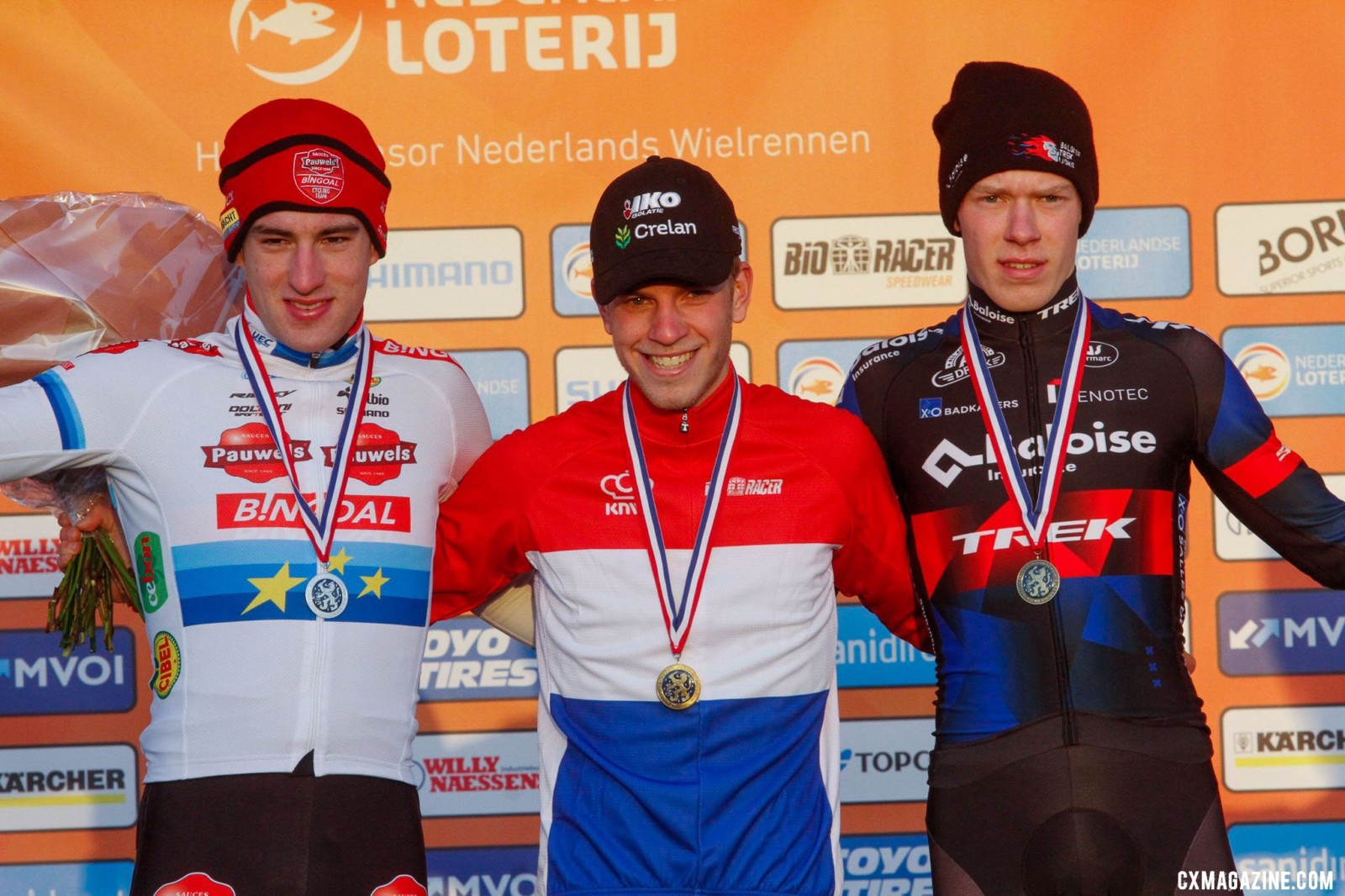 Mees Hendrikx, Ryan Kamp, and Pim Ronhaar on the podium. 2022 Dutch Cyclocross National Championships, Elite Men. Rucphen. © B. Hazen / Cyclocross Magazine