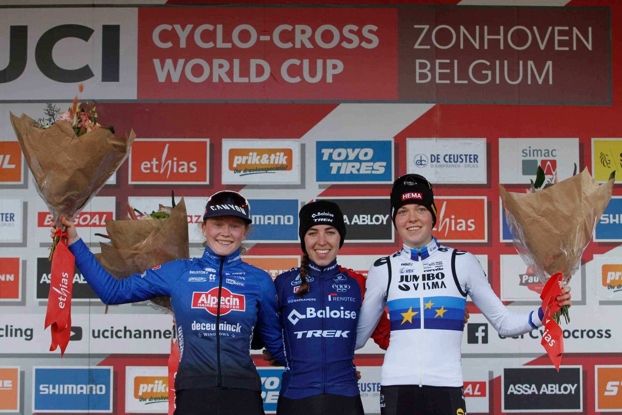 Shirin van Anrooij, Puck Pieterse, Fem van Empel on the podium. 2023 UCI World Cup Zonhoven, Elite Women © Chris Merriam / Cyclocross Magazine
