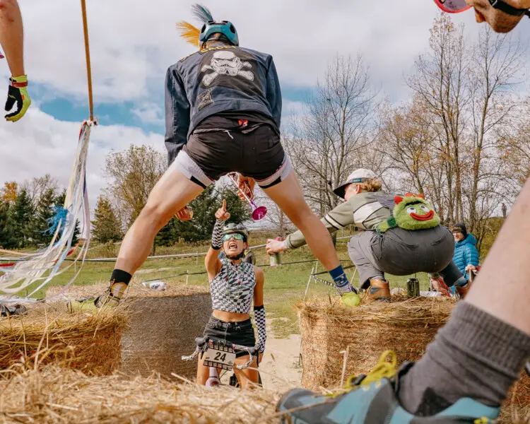 Contestants had to navigate an ever-changing maze of hay bales. 2024 SSCXWC Wisconsin - Singlespeed Cyclocross World Championships. © Mitchell Vincent