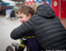 zachary-smith-pdx-devo-junor-cycling-team-gets-a-warm-embrace-after-the-9-10-race-brian-nelson