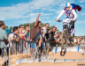 evil-knielvel-gets-big-air-entertains-fans-over-the-beer-kegs-2015-clifbar-cykel-scramble-a-yee-cyclocross-magazine